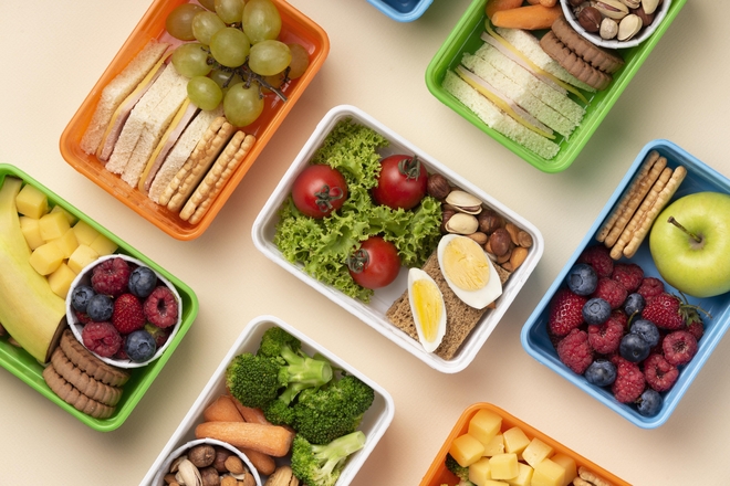 Top view healthy food lunch boxes assortment min